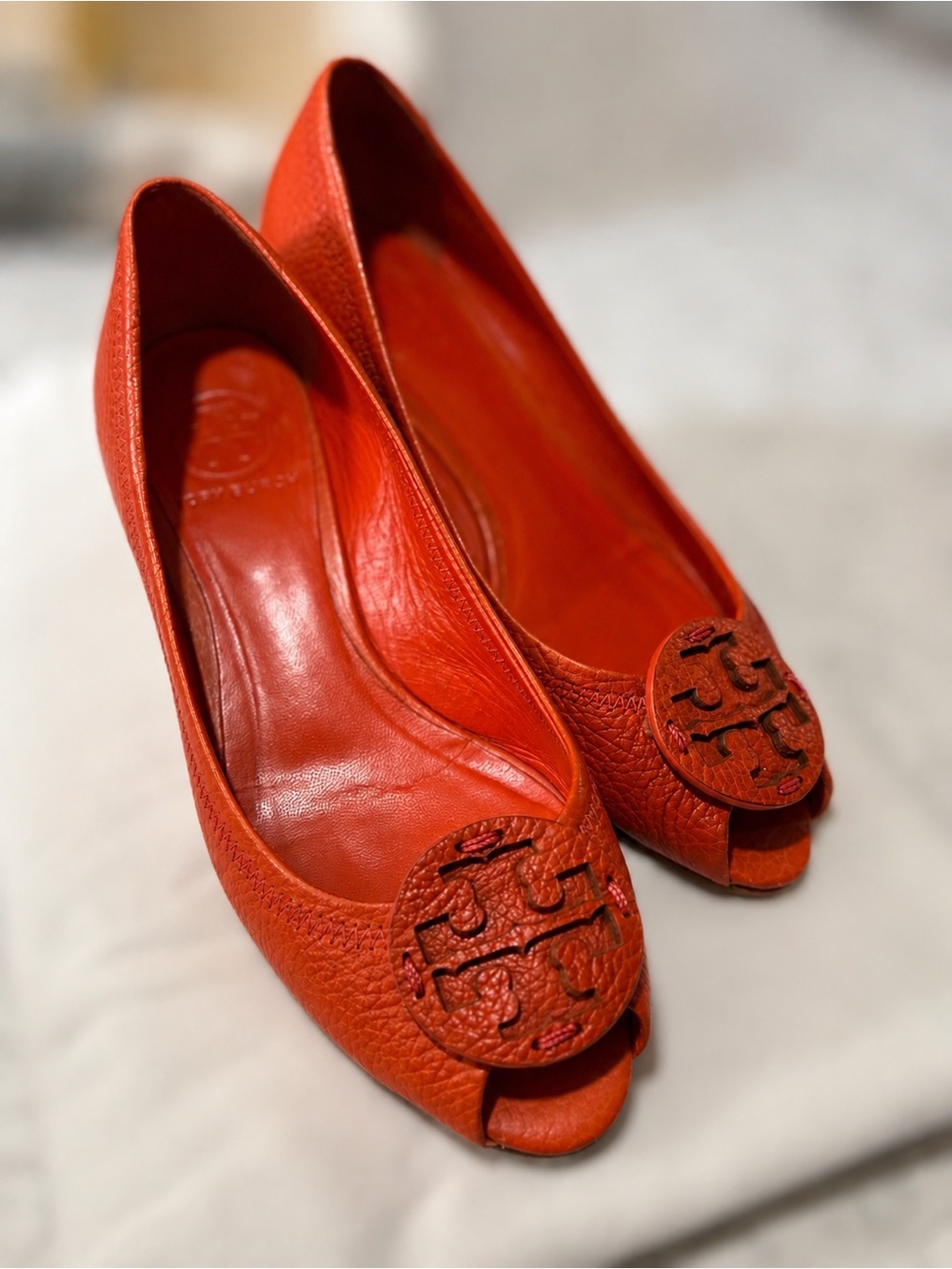 Tory Burch Bright Orange Pebbled Leather Peep-Toe Flats with Logo Medallion